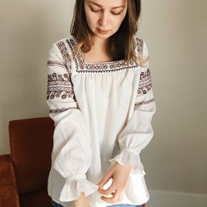 white embroidered blouse